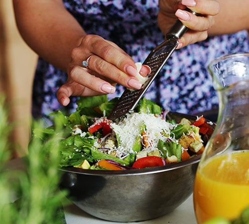 Person eating salad